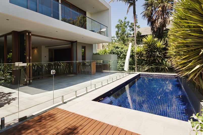 A residential pool and balcony installation.
