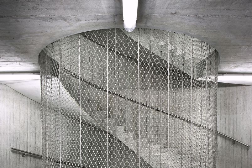 Jakob Webnet N2 stainless steel mesh is used for internal stairwell fall protection.