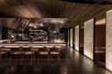 Bamboo poles create a feature ceiling at Raku, a restaurant in Canberra.