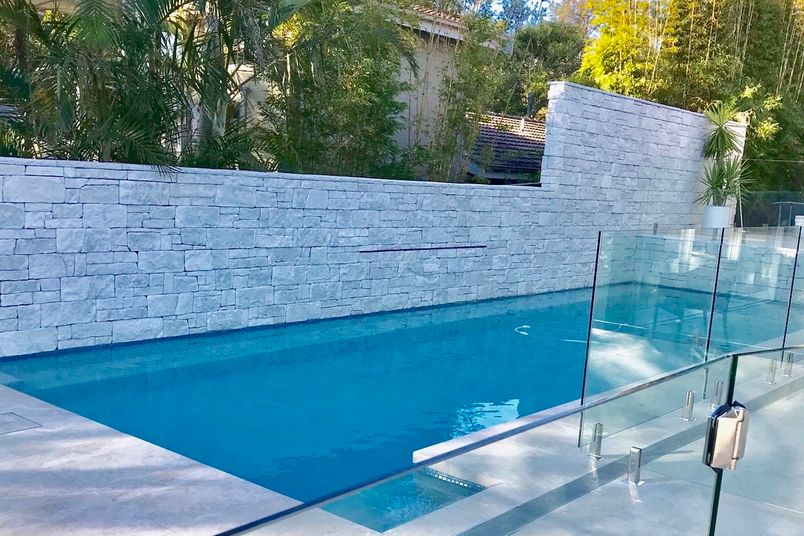 Dry Stack Collection in Limestone, installed for a pool area.
